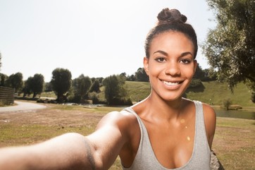 Young woman taking a picture of herself